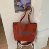 2026 Bolsa Feminina Mais Vendida Bolsa Tote Prática de Grande Capacidade Bolsa de Lona com Estampa de Letras para Estudante Bolsa de Tecido Oxford