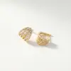 Pendientes de clip de cobre de venta caliente transfronterizos europeos y americanos, Pendientes de moda vintage de múltiples capas, Accesorios para orejas con diseño creativo hueco densamente incrustado