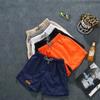 Pantalones de tres puntos para hombre, pantalones de playa de verano, pantalones casuales de color caramelo, pantalones cortos deportivos, pantalones cortos de moda para hombre, venta al por mayor