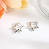 Aretes de estrella hueca brillante de cobre simple a la moda, hebilla para la oreja, diseño de nicho de alta gama para mujer, aretes de amor que combinan con todo