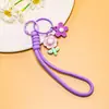 Venta al por mayor de pequeños, frescos, estilo coreano, flor de girasol acrílica, flor de goma suave, cordón trenzado hecho a mano, accesorios para cordón de teléfono