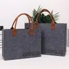Bolsa de fieltro personalización Bolso de mano para banquetes Recuerdo de evento Gran capacidad Logo exclusivo Bolso de mano portátil de fieltro