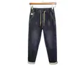 Novas calças casuais de outono e inverno, cintura elástica moderna, forradas com fleece, jeans espessado, calças masculinas soltas stretch slim-fit