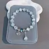 Pulsera de la suerte con diseño de flor de durazno para mujer, estilo San Valentín, color gris, con campanas de luna, a juego, 2023