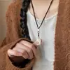 Collar con cordón tejido y colgante de gato flocado para mujer, estilo nicho de lujo ligero de alta gama, cadena larga personalizada para suéter