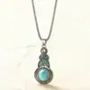 Conjunto de Collar y Aretes con Colgante Geométrico de Cristal Azul Incrustado con Turquesa