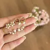Nuevos Pendientes de Perlas Estilo Coreano 2026 Lujo Ligero Gama Alta Accesorios para Pendientes Brazaletes para Orejas Diseño de Nicho Sentido del Temperamento Pendientes de Botón para Mujer