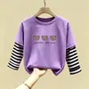Camiseta de manga larga de algodón puro para niño 2026 primavera y otoño nueva elegante de dibujos animados estilo dos piezas falsas camiseta base de primavera para niño