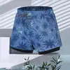 Bañador de cinco puntos estilo vacacional con estampado de palmeras, forro de doble capa para mayor comodidad, corte holgado, cintura con cordón, perfecto para la playa, nadar y uso casual.