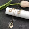 Conjunto de pendientes y collar Xuping estilo vintage de nicho europeo y americano transfronterizo, conjunto de joyería elegante de aleación de cobre, venta al por mayor y hecho a medida
