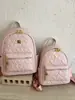 Nueva mochila con relieve en forma de corazón transfronteriza para estudiantes, bolsa ligera para viajes diarios, mochila pequeña de nicho de lujo ligero