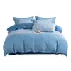 Juego de cama de cuatro piezas Meimiankang Duoai de poliéster puro, disponible en stock para venta al por mayor, juego de funda de edredón de color sólido simple lavable, tela lavable