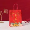 En stock Venta al por mayor Año Nuevo Texto Portátil Bolsa de Papel Kraft Buena Suerte Impresión Anual Bolsa de Regalo Bolsa de Empaque para Regalo de Fiesta