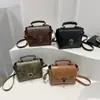 2025 Bolso Cuadrado Pequeño Nuevo con Cierre de Giro Estilo Coreano Bolso de Mujer Bolso de Hombro de Moda Bolso de Mano Simple de Moda Bolso Cruzado Retro