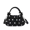 Bolso de lunares para debajo del brazo para mujer, nuevo bolso de mano chic estilo coreano de nicho para el otoño de 2026, bolso de hombro moderno para el trabajo y los desplazamientos