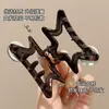 Pinza Dorada con Forma de Estrella Estilo Coreano para Mujer 2026 Modelo Nuevo Pinza de Pelo de Gama Alta Pinza de Tiburón Elegante para Recogido Accesorio para el Cabello