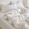 Juego de cuatro piezas de algodón seersucker blanco puro lavado para hotel B&B Clase A, funda de edredón 100% algodón, sábana y sábana bajera