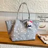 Bolsa de lona con estampado de leopardo para mujer, bolsa de gran capacidad, nuevo modelo 2026, bolso de mano de estrella transfronterizo, bolso de hombro para el trabajo, bolsa versátil