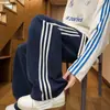 Pantalones deportivos de tres rayas de estilo americano de alta resistencia para hombre, pantalones finos de otoño de pierna ancha, pantalones casuales rectos holgados