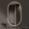 Espelho inteligente de banheiro oval com moldura de alumínio, espelho com iluminação LED, espelho de parede para toucador para o banheiro, disponível para vendas transfronteiriças e personalizável