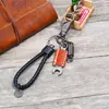 Chaveiro de couro trançado vintage direto da fábrica loja online criativa pequeno presente simples para carro chaveiro de couro de vaca