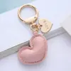 Bolsa Simples de Couro para Fones de Ouvido Chaveiro Bolsa de Viagem Mochila Pingente Pequeno Bolsa de Carro Pingente de Chaveiro Atacado