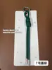 Estilo Coreano Nuevo Llavero Tejido Hecho a Mano Creativo Color Sólido Cuerda de Cuero PU Colgante Simple Versátil Accesorio para Bolsos Venta al por Mayor