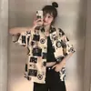 Camisa Floral Versátil Jovem Fina de Cinco Mangas com Lapela Estilo Hong Kong Retro Meia Manga Tendência Cool Bonita Preguiçosa Cardigã