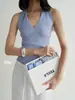 Top de rebaja con diseño de cuello halter cruzado para mujer, de punto acanalado, ajustado, sin mangas, cuello en V