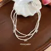 Colar de pérolas com laço multicamadas estilo francês, moderno e versátil para o dia a dia, corrente para clavícula com toque de luxo leve e sofisticado para mulheres