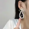 Pendientes de perla con lazo, frescos y elegantes, aretes versátiles de estilo hada para mujer, accesorios de joyería para orejas de estilo nicho japonés coreano, venta al por mayor