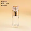 Material de empaque para set de cuidado de la piel con tapa acrílica color oro rosa, botella de vidrio transparente para loción de presión, botella dispensadora sellada para crema facial