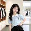 Conjunto de Saia para Meninas Verão 2026 Novo Estilo Polo Manga Curta Meia-Saia Conjunto de Duas Peças Roupa Estilosa Estilo Coreano para Meninas