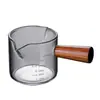 Mini jarra de leche con asa lateral y escala, hecha de vidrio de borosilicato de alta calidad, simple y engrosada, resistente a altas temperaturas, adecuada para uso doméstico