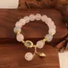 Pulsera bicolor de cristal azul natural y cristal rosa con diseño de oso y rosa, una pulsera blanca de lujo ligero y estilo antiguo fresco.