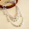 Collar de borlas multicapa con cuentas de perlas vintage europeo y americano, cadena para la clavícula nicho y única, joyería de alta gama para mujer