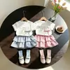 Conjunto Estiloso de Verão com Camiseta Manga Curta Fina e Saia Plissada Curta para Bebês Meninas 2026 Novo Conjunto de Duas Peças com Camiseta de Desenho Animado