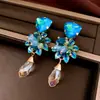 Aretes colgantes de flor con incrustaciones de diamantes y aguja de plata, moda europea y americana, aretes elegantes y de lujo ligero, aretes nuevos y elegantes al por mayor