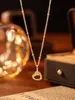 Collar de doble anillo con forma de corazón de alta gama, moderno y único para mujer, cadena para la clavícula de acero de titanio color dorado, joyería que no se decolora