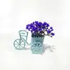 Mini maceta de bicicleta con flores de gipsófila artificiales, planta pequeña en maceta simple multicolor, decoración de escritorio, flores artificiales para el hogar al por mayor