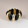 Pulsera elástica de cuentas acrílicas negras retro transfronteriza europea y americana, sensación de lujo ligero y alta gama, joyería de mano estilo festivo para mujer