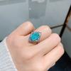 Anillo de Esmeralda de Turmalina Paraíba Simulada Huayoumei Joyería Personalidad Europea y Americana Anillo de Gema de Corindón Rojo para Mujer
