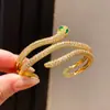 Pulsera Brazalete Abierto de Serpiente con Circonita Chapado en Oro Real de 18K Estilo de Lujo Ligero Gama Alta Personalidad Estilo Fresco Joyería de Mano Venta al por Mayor