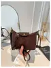 Bolsa de Mão Feminina de Camurça Design Nicho Francês Outono 2026 Versátil para o Dia a Dia Bolsa Transversal Casual Bolsa Dumpling