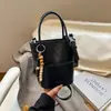 Bolso Cubo de Mujer Más Vendido Transfronterizo 2026 Nuevo Bolso de Hombro Versátil con Bloques de Color, Sensación de Alta Gama y Bolso Cruzado de Lujo Ligero