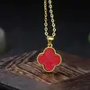 Venta al por mayor en cadena de suministro en vivo de piezas sueltas para juegos de colgantes, anillos, pendientes y collares de trébol de cuatro hojas incrustados con arena de cinabrio y oro púrpura