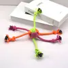 Juguete para mascotas bola de cuerda de algodón de azúcar bicolor limpieza de dientes molares juguete resistente a la mordida nudo juguete para perro juguete para perro al por mayor