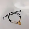 Piedra ojo de gato placa dorada de la suerte este año cuentas de buena suerte cuerda roja tejida pulsera de la paz regalo de nicho cuerda para la mano hombres y mujeres