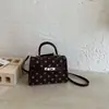 Bolso de lunares de alta gama para mujer, nuevo bolso cruzado versátil de moda 2026, bolso de mano exquisito, bolso Kelly