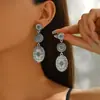 Brincos Longos Europeus e Americanos Transfronteiriços Mais Vendidos Retro com Franjas em Forma de Gota Flor de Abóbora Criativa Antiga Brincos de Turquesa